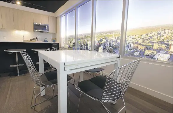 ?? DAVID BLOOM ?? The popularity of condos in the Ice District’s Sky Residences, such as this two-bedroom show suite, helped boost new condo sales in Edmonton last year, a report by Urban Analytics says. The units range in price from about $300,000 to more than $1...
