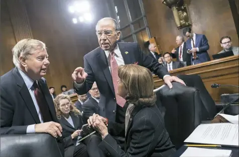  ?? J. Scott Applewhite/Associated Press ?? From left, Sen. Lindsey Graham, R-S.C., Senate Judiciary Committee Chairman Chuck Grassley, R-Iowa, and Sen. Dianne Feinstein, D-Calif., the ranking member, confer Thursday on Capitol Hill before considerin­g a bipartisan bill to protect the special...