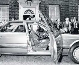  ??  ?? > Thatcher at the wheel of the Rover in Downing Street on July 10, 1986