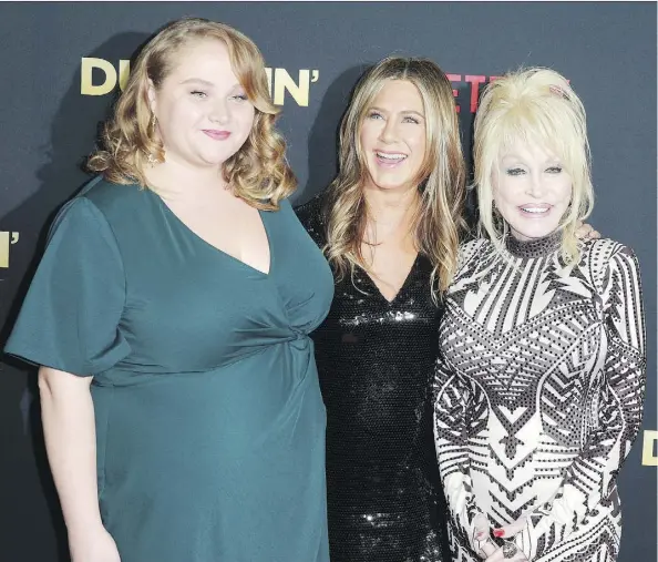  ?? RICH FURY/GETTY IMAGES ?? Country music star Dolly Parton, right, seen with actors Danielle Macdonald, left, and Jennifer Aniston at the Hollywood première of Netflix’s Dumplin’, collaborat­ed with musician Linda Perry, formerly of 4 Non Blondes, on the movie’s soundtrack.