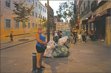  ??  ?? Sex worker Lulu waits for clients at her usual corner in central Mexico City. (AP/Rebecca Blackwell)