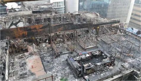  ?? — AFP ?? View of a burned building where a rooftop party was being held in Mumbai.