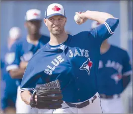  ?? The Canadian Press ?? Toronto Blue Jays starting pitcher J.A. Happ throws at spring training in Dunedin, Fla. Happ will be the Blue Jays’ opening-day starter this season.