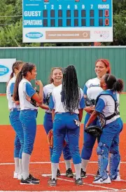  ??  ?? Southeast High School infielders meet before the first pitch at their new softball field on Tuesday afternoon.