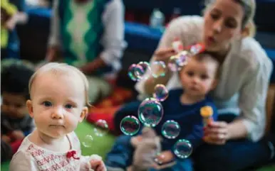  ?? JONATHAN NACKSTRAND/AFP/GETTY IMAGES ?? Babies in Stockholm may be beyond gender, but not bubbles.