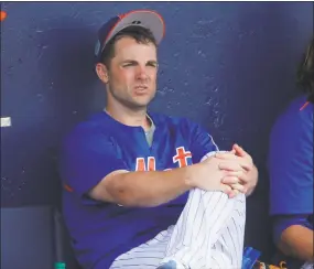  ?? John Bazemore / Associated Press ?? David Wright does not wish to permanentl­y sit on the sidelines - he still intends to play again for the New York Mets.