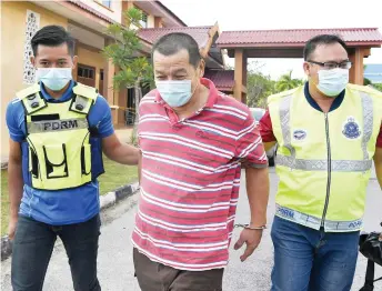  ?? — Bernama photo ?? Ong being led from the court following the hearing.