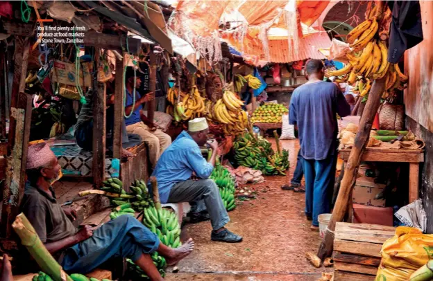  ??  ?? You'll find plenty of fresh produce at food markets in Stone Town, Zanzibar.