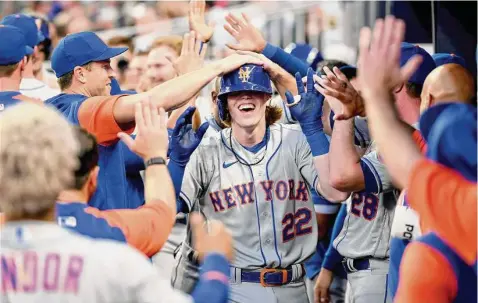  ?? Adam Hagy/TNS ?? The New York Mets’ Brett Baty (22) celebrates with teammates after hitting his first home run during his first MLB at bat, against the Atlanta Braves in the second inning at Truist Park on Aug. 17 in Atlanta.