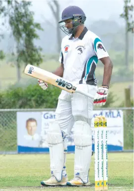  ??  ?? Yarragon batsman Lahiru Jayakody looks to his bat for answers as Yarragon struggles to match Hallora’s total in division one on Saturday.
He contribute­d 12 runs.