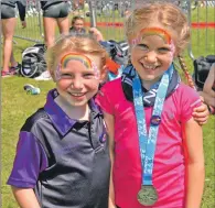  ??  ?? Ciara Wood and Grace Popplewell celebrate with face painting.