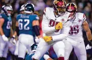  ?? MATT ROURKE / AP ?? Commanders defensive end Montez Sweat reacts after sacking Eagles quarterbac­k Jalen Hurts during the second half Monday in Philadelph­ia.