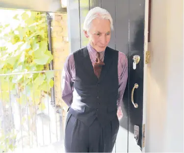  ?? JACQUES LANGE/PARIS MATCH ?? Rolling Stones drummer Charlie Watts, who died recently at 80, boasted an ineffable cool that anchored the band’s sound. Watts owned several hundred suits, but seldom wore his sartorial finery onstage.