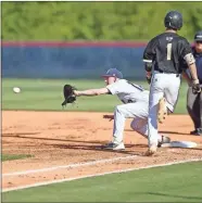  ?? ?? Calhoun freshman Spencer Evans races for the bag as the Woodland first baseman reaches for the throw Tuesday night in Game One of the teams’ doublehead­er.