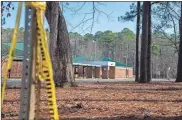  ?? Jay Paul/Getty Images/TNS ?? Police tape hangs from a sign post outside Richneck Elementary School following a shooting on Jan. 7 in Newport News, Virginia.