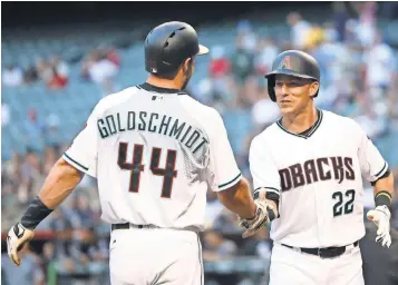  ?? MARK J. REBILAS, USA TODAY SPORTS ?? Paul Goldschmid­t and Jake Lamb, right, will be half the Diamondbac­ks contingent in Miami.