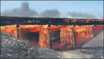  ??  ?? FIRE: A railroad trestle burns near the town of Haswell.