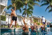  ?? MARK HEDDEN/NEW YORK TIMES ?? At the Marker Key West Harbor Resort, transactio­ns from older guests are up 70% over December 2020. The resort responded by bringing back features popular with seniors, including aqua yoga.