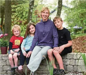  ??  ?? Lionberger is a cancer survivor who took up running to aid in her recovery. Here, she’s with her three children, Marshall, four, Sierra, seven, and Evan, nine.