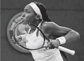  ?? Alastair Grant / Associated Press ?? American teenager Cori Gauff extended her stay at Wimbledon on Wednesday night by beating Magdalena Rybaikova just two days after ousting her idol, Venus Williams.