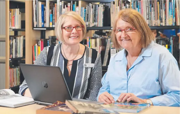  ?? Picture: JUSTIN BRIERTY ?? WELL READ: Lyndell Sellars (Cairns State High) and Verdi Reid (St Andrew's Catholic College) have seen many changes in teacher and librarian roles.