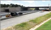  ?? NWA Democrat-Gazette/FLIP PUTTHOFF ?? Traffic moves through a work zone Tuesday on Interstate 49 in Bentonvill­e near Northwest Arkansas Community College. Mitchell Archer, constructi­on engineer, said the Eighth Street interchang­e project, expected to be completed by December, is using what are called braided ramps because of the proximity of two exits. There will also be tunnels under the Eighth Street bridge for ramps.