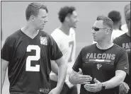  ?? AP/Atlanta Journal-Constituti­on/CURTIS COMPTON ?? Atlanta offensive coordinato­r Steve Sarkisian (right), seen talking with quarterbac­k Matt Ryan during training camp, said he’s moved on from the questionab­le play call he made that ended the Falcons’ playoff run last season.