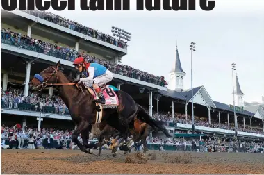  ?? Tim Nwachukwu
/ Getty Images /TNS ?? Medina Spirit, with jockey John Velazquez, crosses the finish line to win the 147th running of the Kentucky Derby at Churchill Downs on May 1, in Louisville, Kentucky.