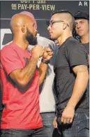  ?? Heidi Fang ?? Las Vegas Review-journal UFC flyweight champion Demetrious Johnson, left, and challenger Ray Borg face off at T-mobile Arena during UFC 216 media day on Wednesday.