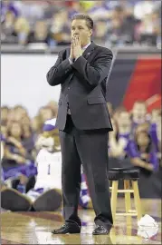  ?? SAM RICHE / TRIBUNE NEWS SERVICE ?? Kentucky coach John Calipari watches late in the second half Saturday night at Lucas Oil Stadium in Indianapol­is as Wisconsin drops his Wildcats to 38-1.