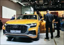  ?? LI FUSHENG / CHINA DAILY ?? An Audi Q8 attracts visitors’ attention at the Guangzhou auto show last year.