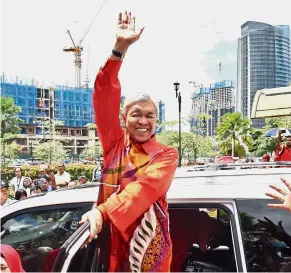  ??  ?? Holding court: Dr Ahmad Zahid leaving the courts complex in Kuala Lumpur.