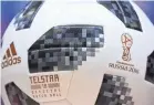  ?? PATRICK HERTZOG/AFP/GETTY IMAGES ?? The World Cup ball, Telstar 18, mirrors the solar panels on the Telstar satellites.