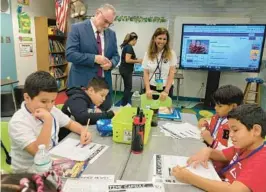  ?? STEVE BOUSQUET/SOUTH FLORIDA SUN SENTINEL ?? Dr. Peter Licata speaks to a group of students at Bennett Elementary School in Fort Lauderdale.