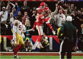  ?? John Locher/Associated Press ?? Kansas City Chiefs quarterbac­k Patrick Mahomes (15) celebrates with wide receiver Mecole Hardman Jr. (12) after Hardman scored the game-winning touchdown against the San Francisco 49ers in overtime during Super Bowl 58 on Sunday in Las Vegas.