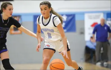  ?? O-N-E PHOTOS BY BRIAN HENDRIX ?? ABOVE: Fred T. Foard senior guard Davoney Dellinger (2) competing against North Lincoln on Jan. 16, 2024. BELOW: Lady Tigers senior guard Davoney Dellinger (2) going for the triple during the 2023-24 season.