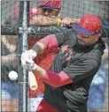  ?? AP photo ?? Phillies left fielder Kyle Schwarber bats during a spring training baseball workout Friday in Clearwater, Fla.