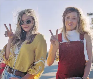  ?? THE CANADIAN PRESS ?? Elizabeth Olsen, left, and Aubrey Plaza shown in a scene from Ingrid Goes West, a study in the dangers of social media.