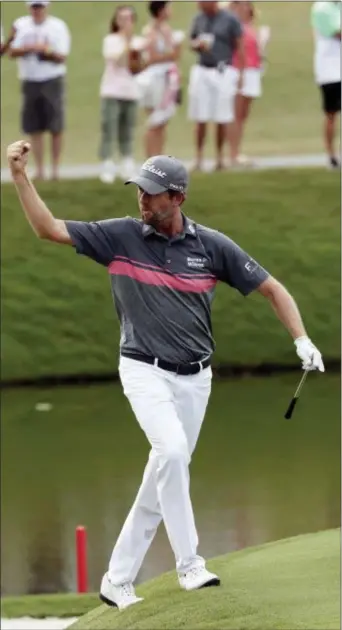  ?? JOHN RAOUX — THE ASSOCIATED PRESS ?? Webb Simpson celebrates an Championsh­ip . eagle on the 11th hole during the third round of The Players
