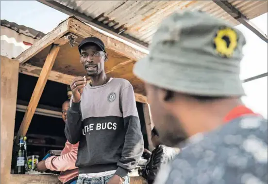  ?? Photo: Delwyn Verasamy ?? Up in smoke: Tebogo Seele and his cousin Spanner (above) outside his shop (above and left) in Katlehong, Gauteng. Spanner says he was tricked by the police into signing an admission of guilt after he was arrested for possession of cannabis.