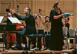  ?? ROBERT TORRES ?? Artistic director Jonathan Cohen and soprano Teresa Wakim during Handel and Haydn Society’s program Friday.