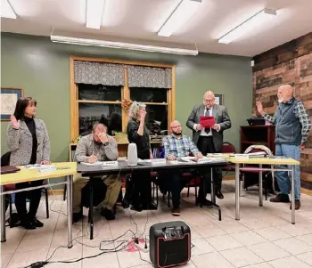  ?? Patrick Tine/times Union ?? The Rockwell Falls Public Library’s three new trustees, from left, Rosemarie Gardner, Margaret Hartley and Ted Mirczak, take the oath of office Tuesday.