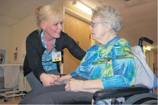  ?? JIM DAY/THE GUARDIAN ?? Beach Grove Home resident care worker Crystal Dumville of Brackley Beach chats with resident Rosalind McVicar. Dumville says she was overwhelme­d to be named the co-recipient of the provincial Shelley L. Woods Excellence in Person Centred Care Award.