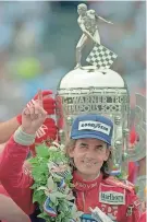  ?? AL BEHRMAN, MILWAUKEE JOURNAL SENTINEL ?? Arie Luyendyk poses in victory lane after the 1990 Indianapol­is 500, the first of two he won.