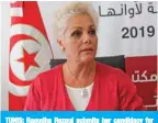  ?? — AFP ?? TUNIS: Raoudha Rezgui submits her candidacy for the upcoming early presidenti­al elections at the Independen­t High Authority for Elections (ISIE) in the capital Tunis.