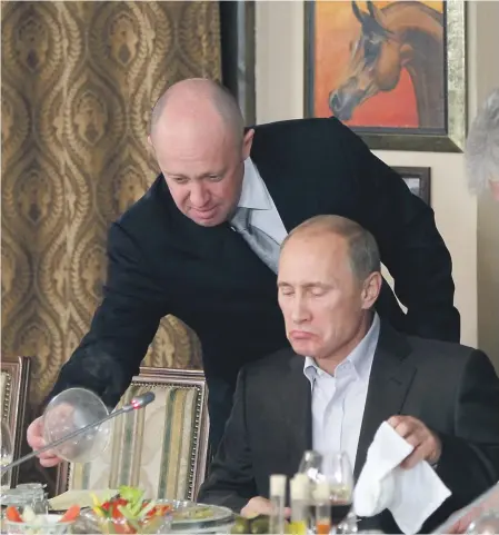  ?? FOTO - TASR/AP ?? Prigožin (vľavo) a Putin.