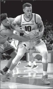  ?? NWA Democrat-Gazette/ANDY SHUPE ?? Arkansas forward Daniel Gafford (10) sat for a key stretch in the second half of the Razorbacks’ 73-71 victory Saturday at Texas A&amp;M with four fouls.