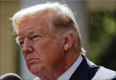  ?? PABLO MARTINEZ MONSIVAIS — THE ASSOCIATED PRESS ?? In this photo, President Donald Trump listens to a questions prior to speaking to members of the media in the Rose Garden of the White House. Trump is proving to be an erratic trading partner as he kicks thorny policy issues to Congress and then sends...