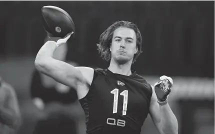  ?? DARRON CUMMINGS/AP ?? Pittsburgh quarterbac­k Kenny Pickett throws a pass during the NFL scouting combine March 3 in Indianapol­is. Pickett is regarded as a safe bet to become a productive starter in the NFL.