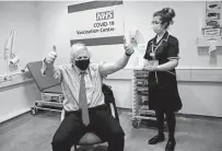  ?? Frank Augstein / Associated Press ?? British Prime Minister Boris Johnson gives a thumbs-up after receiving the first dose of the Astrazenec­a vaccine on Friday.